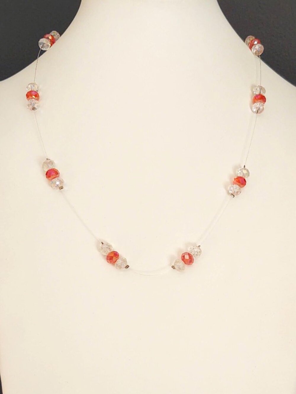 Floating clear and orange crystal necklace